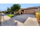 Inviting single-story home with a lush green lawn and well-maintained landscaping at 7710 N Via De Fonda St, Scottsdale, AZ 85258