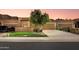 Charming single-story home with a well-manicured lawn and a two-car garage at 7710 N Via De Fonda St, Scottsdale, AZ 85258