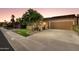 Beautiful single-story home with desert landscaping, a two-car garage, and a welcoming entrance at 7710 N Via De Fonda St, Scottsdale, AZ 85258