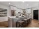 Modern kitchen with white cabinets, stainless steel appliances, and a large island at 7710 N Via De Fonda St, Scottsdale, AZ 85258