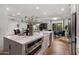 Bright open kitchen featuring a farmhouse sink, stainless steel appliances, and modern finishes at 7710 N Via De Fonda St, Scottsdale, AZ 85258