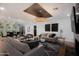 Comfortable living room showcasing modern lighting, a wine display, and stylish decor at 7710 N Via De Fonda St, Scottsdale, AZ 85258