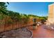 Inviting backyard patio with neatly trimmed hedges, potted plant and comfortable seating, creating an ideal outdoor escape at 7710 N Via De Fonda St, Scottsdale, AZ 85258