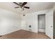 Minimalist bedroom featuring tile flooring and neutral paint at 813 N Gilbert Ave, Casa Grande, AZ 85122