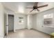 Bright bedroom with wood-look flooring and large window at 813 N Gilbert Ave, Casa Grande, AZ 85122