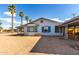 Small single-story home with teal shutters at 813 N Gilbert Ave, Casa Grande, AZ 85122