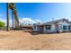 This darling cottage features desert landscaping and quaint shutters at 813 N Gilbert Ave, Casa Grande, AZ 85122