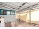 Covered patio with concrete floor, partial screen wall, and view into the yard at 813 N Gilbert Ave, Casa Grande, AZ 85122