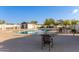 Community pool area with table and chairs, perfect for neighborhood gatherings and Gathering fun at 8606 W Caribbean Ln, Peoria, AZ 85381