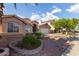 Charming single-story home with a well-maintained front yard with desert landscaping at 8606 W Caribbean Ln, Peoria, AZ 85381