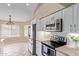 Modern kitchen with stainless steel appliances and ample counter space at 8606 W Caribbean Ln, Peoria, AZ 85381