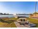 Lakeside seating and a fountain create a scenic spot for relaxation and enjoying community views at 8606 W Caribbean Ln, Peoria, AZ 85381