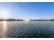Scenic lake view with a water fountain, showcasing a serene and peaceful community setting at 8606 W Caribbean Ln, Peoria, AZ 85381