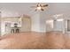 Open-concept living room featuring tile floors, high ceilings and an abundance of natural light at 8606 W Caribbean Ln, Peoria, AZ 85381