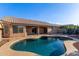 A backyard pool offers a refreshing escape with its inviting blue water and stone deck at 8606 W Caribbean Ln, Peoria, AZ 85381