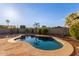 Enjoy the outdoors in this kidney-shaped pool with brick wall and mature landscaping at 8606 W Caribbean Ln, Peoria, AZ 85381