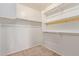 Walk-in closet with carpeted floors, white walls, and shelving to store belongings at 8606 W Caribbean Ln, Peoria, AZ 85381