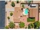 Aerial view of property showing backyard pool, detached garage, RV parking, and desert landscaping at 8913 W Country Club Trl, Peoria, AZ 85383