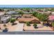 Aerial view of home in a well-maintained neighborhood with mature trees and a desert landscaped yard at 8913 W Country Club Trl, Peoria, AZ 85383