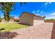 Lush backyard featuring a large garage and a charming single-story house at 8913 W Country Club Trl, Peoria, AZ 85383
