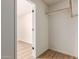 Walk in closet featuring wood floor and room for ample storage at 8913 W Country Club Trl, Peoria, AZ 85383