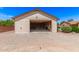 Spacious detached garage interior with an open door showing ample storage space at 8913 W Country Club Trl, Peoria, AZ 85383