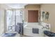Bright bathroom featuring a soaking tub, glass enclosed shower, and tile flooring at 9576 W Blue Sky Dr, Peoria, AZ 85383