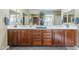 Bathroom featuring a double vanity, modern fixtures, and ample storage at 9576 W Blue Sky Dr, Peoria, AZ 85383