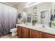 Bathroom features a double sink vanity, decorative accents, and updated fixtures at 9576 W Blue Sky Dr, Peoria, AZ 85383