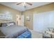 Bedroom featuring a bed, window, closet, and neutral color scheme at 9576 W Blue Sky Dr, Peoria, AZ 85383