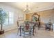 Dining room features a table with decorative chairs and a light fixture creating a focal point at 9576 W Blue Sky Dr, Peoria, AZ 85383