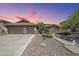 Beautiful single-Gathering home with a large garage, desert landscaping, and a long driveway at 9576 W Blue Sky Dr, Peoria, AZ 85383