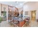 A spacious kitchen features a large island, granite countertops, and wooden cabinetry with decorative vases on top at 9576 W Blue Sky Dr, Peoria, AZ 85383