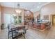 An open-concept kitchen, seamlessly flows to a dining room, enhancing the home's spacious feel at 9576 W Blue Sky Dr, Peoria, AZ 85383