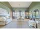Spacious living room with two sofas, carpet flooring, and large windows providing ample natural light at 9576 W Blue Sky Dr, Peoria, AZ 85383