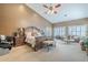 Luxurious main bedroom suite with a sitting area, and lots of space at 9576 W Blue Sky Dr, Peoria, AZ 85383