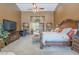 Spacious main bedroom with sitting area and stylish decor at 9576 W Blue Sky Dr, Peoria, AZ 85383