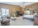 Bright and open main bedroom, with sitting area and ensuite bathroom at 9576 W Blue Sky Dr, Peoria, AZ 85383