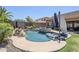 Private backyard features a pool, spa, mature landscaping, and lounge area perfect for entertaining at 9576 W Blue Sky Dr, Peoria, AZ 85383