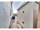 A backyard featuring a storage shed, A/C unit, sidewalk, and partial view of the yard and block fence at 9721 E Juanita Ave, Mesa, AZ 85209
