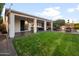 Expansive backyard featuring a covered patio, lush lawn, and outdoor amenities perfect for entertaining guests at 9721 E Juanita Ave, Mesa, AZ 85209