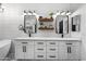 Bright bathroom features dual sinks, white countertops, shiplap walls, and modern fixtures at 9721 E Juanita Ave, Mesa, AZ 85209