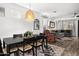 Open-concept dining and living area with stylish furnishings and natural light at 9721 E Juanita Ave, Mesa, AZ 85209