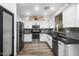 Modern kitchen with stainless steel appliances, granite countertops, and ample cabinet space at 9721 E Juanita Ave, Mesa, AZ 85209