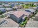 Gorgeous aerial view of a home with desert landscaping, a trampoline, and solar panels in a Gathering-friendly community at 9856 E Palladium Dr, Mesa, AZ 85212