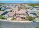 Expansive aerial shot of the neighborhood showcasing homes with tile roofs and well-maintained landscaping at 9856 E Palladium Dr, Mesa, AZ 85212