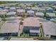 Lovely aerial view of a residential neighborhood with beautiful desert landscaping and backyard trampolines at 9856 E Palladium Dr, Mesa, AZ 85212