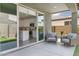 Inviting covered patio with comfortable seating and seamless indoor/outdoor flow to the modern kitchen at 9856 E Palladium Dr, Mesa, AZ 85212