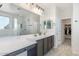 Bright bathroom showcasing a double vanity, modern fixtures, and a glass-enclosed shower at 9856 E Palladium Dr, Mesa, AZ 85212