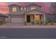 Charming two-story home with a well-maintained front yard and a two-car garage at 9856 E Palladium Dr, Mesa, AZ 85212
